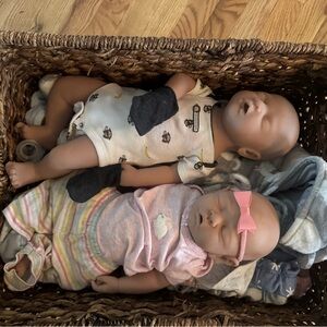 Reborn Dolls in Pink and White Outfits